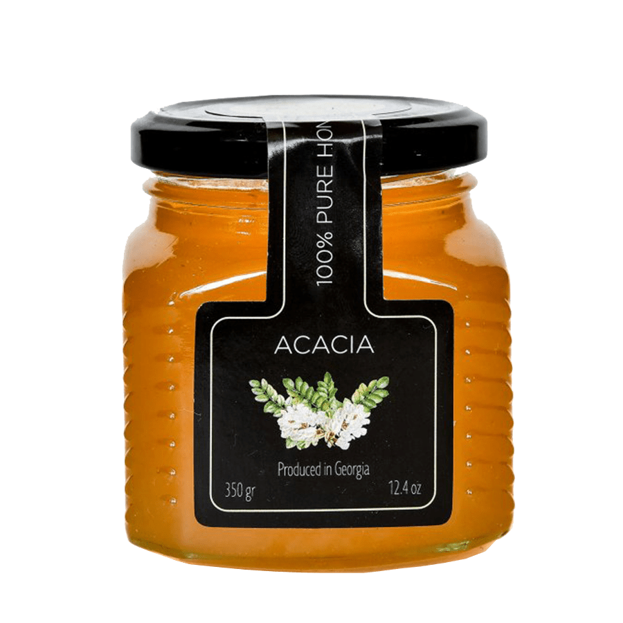 Gruzínský akátový med v malém skle, přírodní produkt z Gruzie s čistou chutí přírody